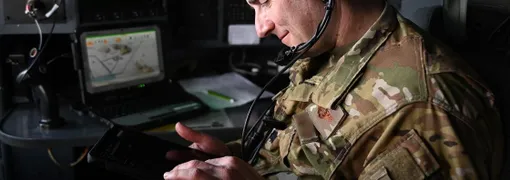 U.S. Airman uses modern computing technology in the field.